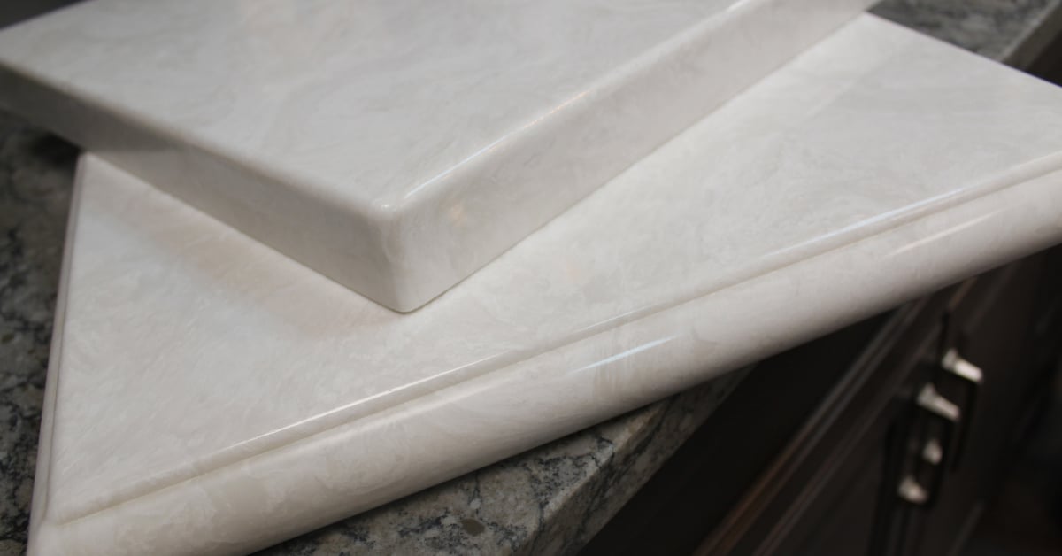 Close-up of cultured marble slabs with different edge treatments