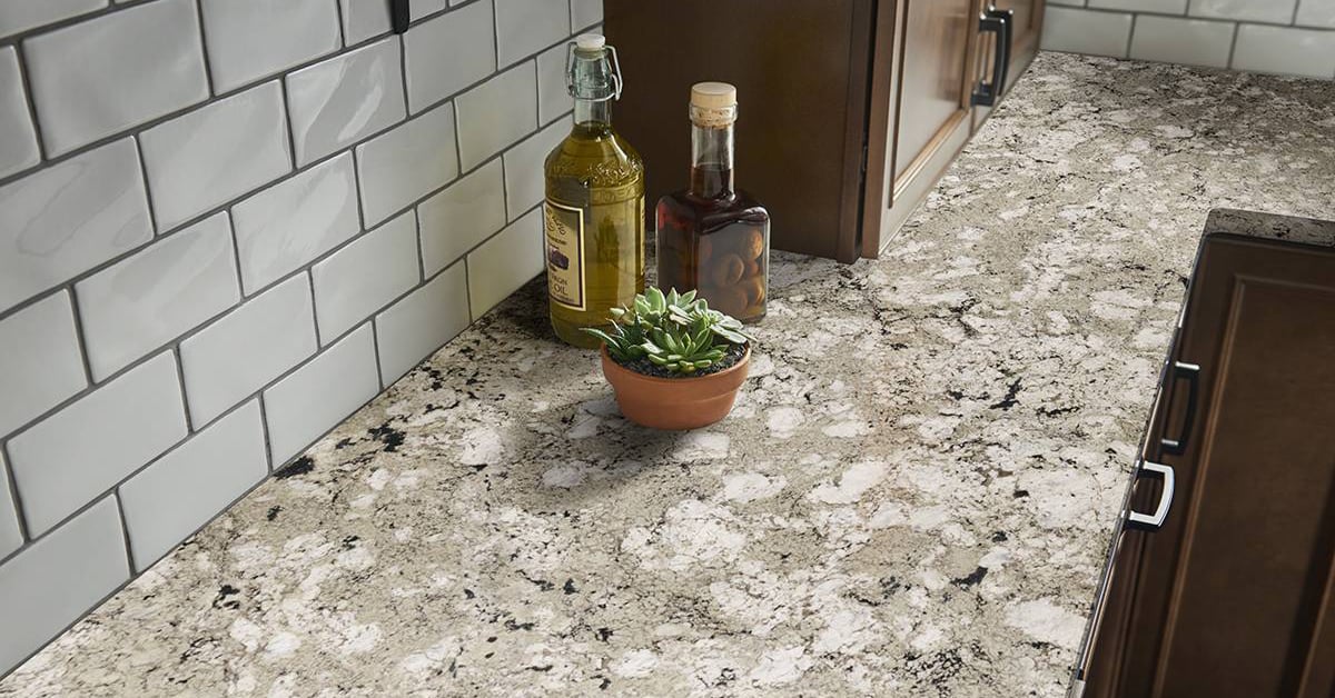 Granite countertop with oil bottles and succulent sitting on top