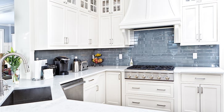 Subtle tile backsplash in a bright modern style kitchen